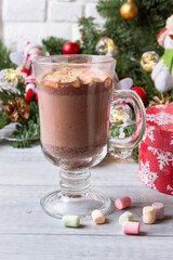 Hot cocoa with marshmallows on the Christmas table.