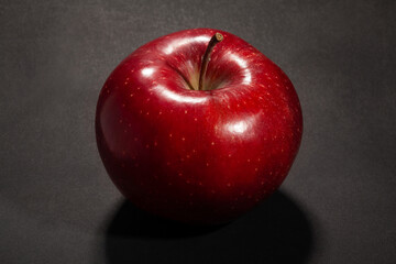 red apple on black background