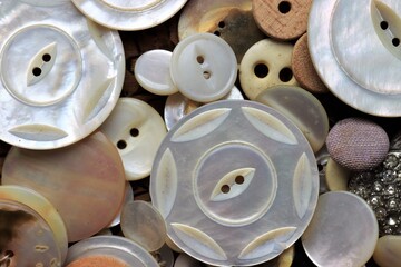 Assortment of old vintage buttons in different sizes.