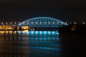 Fototapeta na wymiar View of the Podilskyi Bridge with bright lights at night