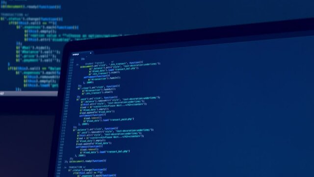 Real Javascript code. Front end web development. Java script JS code on laptop screen. Web design concept.