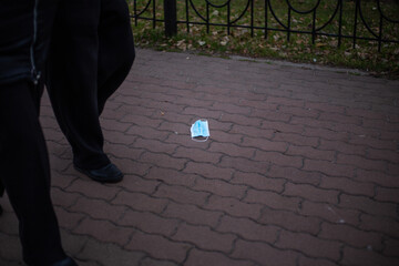 Discarded protective medical mask during the covid-19 coronavirus pandemic