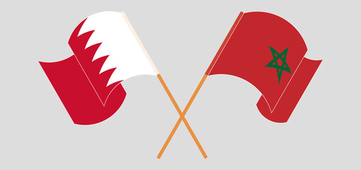 Crossed and waving flags of Bahrain and Morocco
