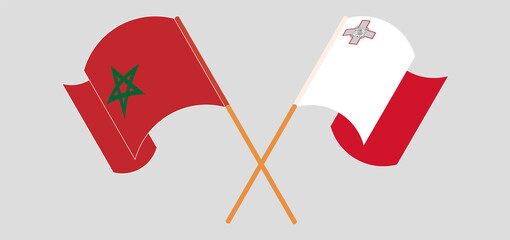 Crossed and waving flags of Morocco and Malta