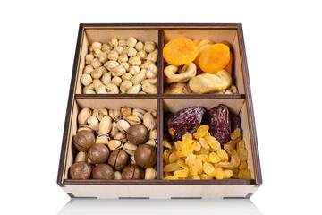 Various dried fruits in a box isolated on white background. Close-up