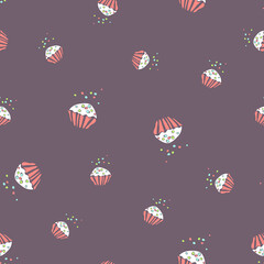 Seamless vector pattern of cupcakes on a brown background