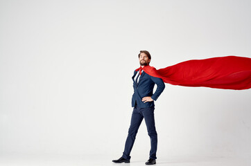 business man with red cloak superhero on light background success victory © SHOTPRIME STUDIO
