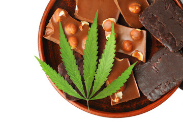 Healthy tasty chocolate chip marijuana cookie with green hemp leaf, CBD chocolate isolated white background