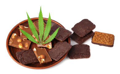 Healthy tasty chocolate chip marijuana cookie with green hemp leaf, CBD chocolate isolated white background