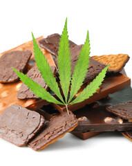 Edible medical marijuana food chocolate bars and chocolate cookies with green hemp leaf isolated on white background. Cannabis chocolates CBD