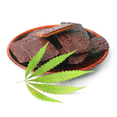 Chocolate chip cookie on saucer marijuana dessert with green hemp leaf on white isolated white background