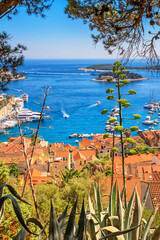 Coastal summer landscape with a top view of the City Harbour of the town of Hvar and Paklinski Islands, the island of Hvar, the Adriatic coast of Croatia