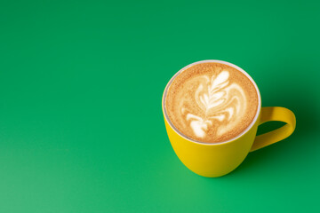 Cup of milk coffee on blue background, copy space for text