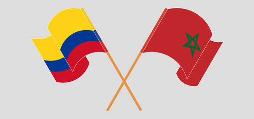 Crossed and waving flags of Colombia and Morocco