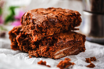 Cake chocolate brownies on on table covered with baking paper