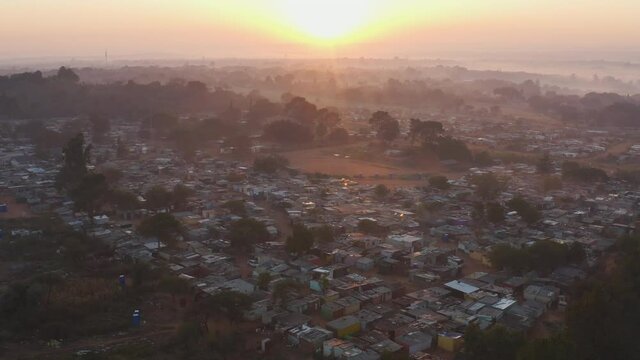 Sunrise zoom in aerial view of a deserted squatter camp during lockdown for Covid-19 Coronavirus pandemic
