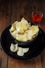 Keripik singkong. Cassava chips or tapioca chips is traditional snack from Java, made of cassava thinly sliced and fried.
