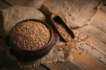 Buckwheat groats closeup. Grains of raw buckwheat as a background texture.