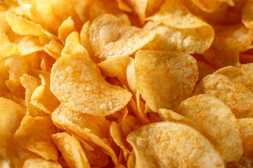 Potato chips or crisps .Potato chips texture background flat overhead view.concept of fast food and snacks. Food background.