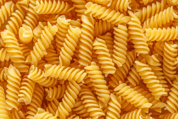 Dry pasta fusilli. Fusilli have spiral shape and yellow color. Pasta is delicious Italian...