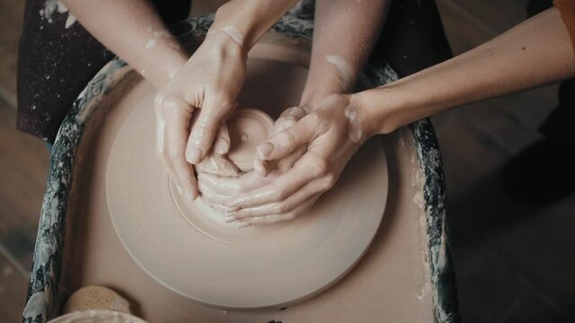 Close up of potter clay wheel, pottery workshop, woman making diy pot to sale in e-commerce store, home hobby