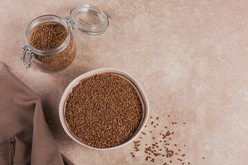 Buckwheat groats topview. Grains of raw buckwheat as a background texture.
