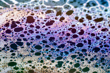 Beautiful psychedelic abstraction formed by light on the surface of a soap bubble