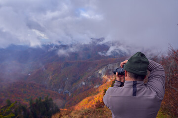 Professional nature photographer in the mountains