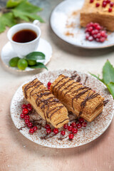 front view yummy cake slice with tea and berries on light background biscuit cake sweet