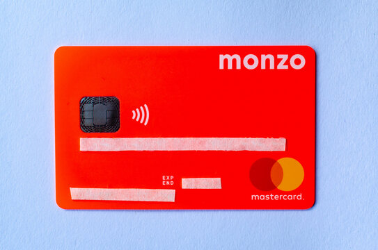 Stone, Staffordshire / United Kingdom - May 27, 2019: MONZO bank card photo with stickers on a personal information. One of the first virtual bank on the UK and US markets.