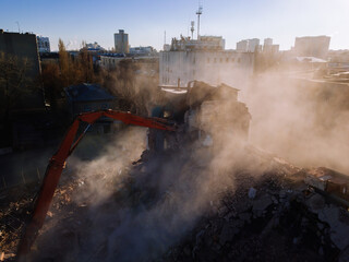 Aerial view of demolition site. Process of demolition of old industrial building