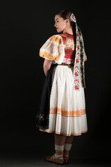 Young beautiful slovak woman in traditional dress. Slovak folklore