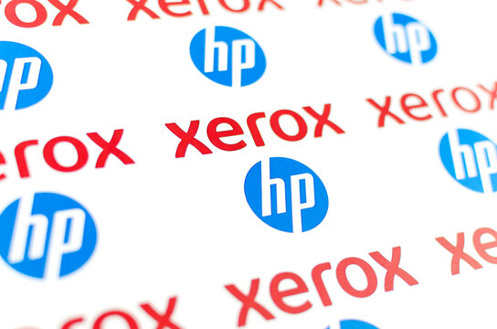 The Paper Brochure With Combined XEROX And HP Logos. Photo With Angled View And Selective Focus. Concept Image.