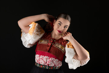 Young beautiful slovak woman in traditional dress. Slovak folklore