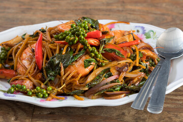 Spicy Thai Drunken Noodles with Shrimps named Pad Kee Mao Goong