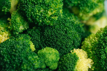 Closeup macro shot of broccoli cabbage. Green healthy background with vegetable broccoli texture. Healthy fresh food background. concept of wholesome food, veganism.