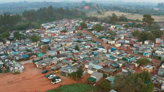 High aerial zoom out view of a squatter camp during lockdown for Covid-19 Coronavirus pandemic