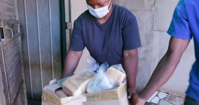 Cropped View Of A Black African Man Delivering Food Parcels To The Poor And Hungry Who Are Badly Affected By Covid-19 Coronavirus Pandemic In South Africa