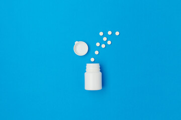 flat lay with pills on blue