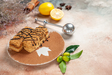 Side view of delicious desserts decorated with chocolate cinnamon and lemon on colourful table
