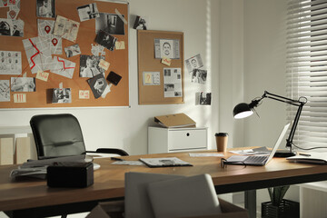 Detective office interior with big wooden desk and evidence board