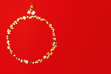 flat lay with christmas ball on red background