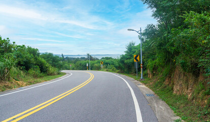 Fototapeta na wymiar Downslope roadway along seaside in Kinmen Island, Taiwan