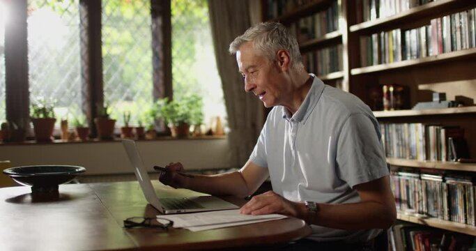 4k, Senior man talking to his family via video chat while social distancing