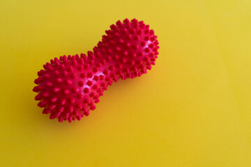 Spiky physiotherapy, fitness sports self massage peanut ball used to roll out tired, sore muscles, tension, strains and to increase flexibility.