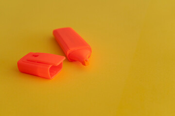 highlighter pencils. various colors on yellow background