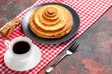 Close up view of easy made pancakes a cup of tea cinnamon lime
