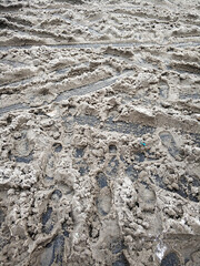 Porridge of snow and grease on the road. Uncleared city roads in winter