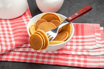 front view little pancakes on a dark background cake dessert sweet
