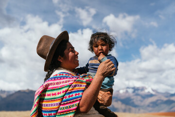 Indigenous mom holding her son